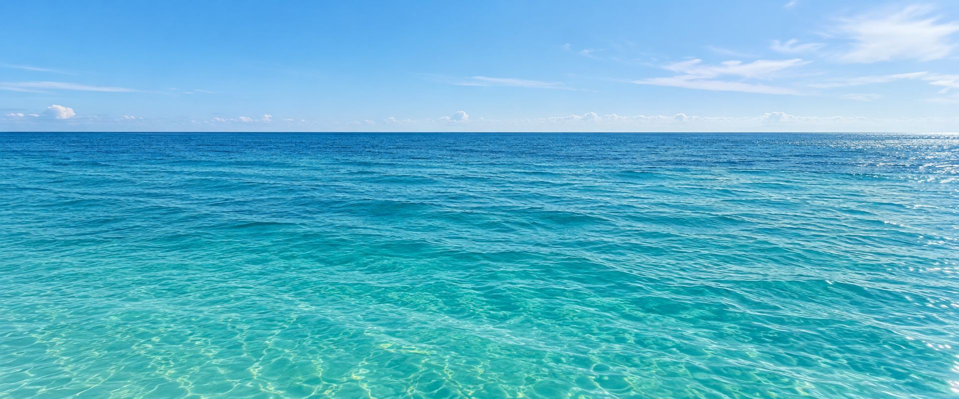 Turquoise Gulf water beneath a clear blue sky